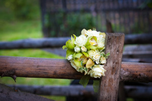 Wedding flowers on a fence post at a Smoky Mountain wedding venue