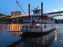 TN Riverboat at dusk with city lights reflecting in the river. 