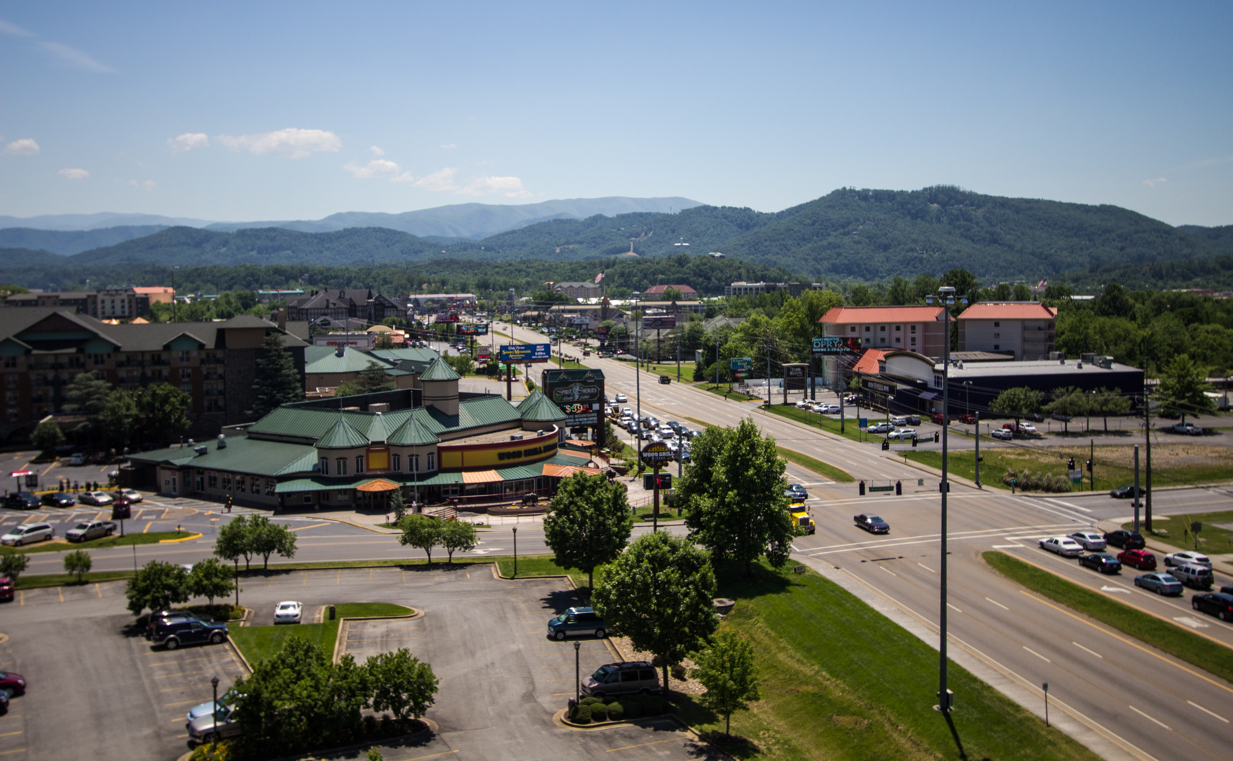 The main parkway in Pigeon Forge from an aerial view with mountains in the background