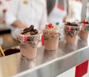 Cups of Andy's Frozen Custard lined up on a counter 